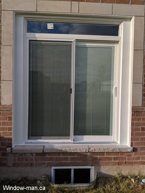6 Six foot Sliding patio doors with blinds. Low e coating, Argon gas. Transom. White. Tilt and lift internal Mini Blinds. Installed by an independent contractor